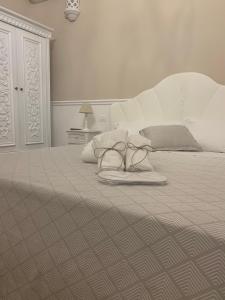 A bed or beds in a room at B&B Palma Salentina