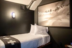 a hotel room with a bed and a lamp at Gravity Haus in Breckenridge