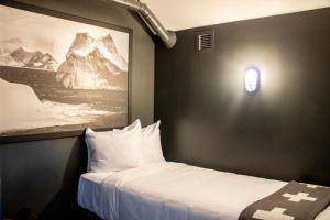 a hotel room with a bed and a lamp at Gravity Haus in Breckenridge