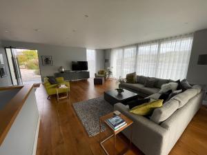 a living room with a couch and a table at Ancarva in Millbrook