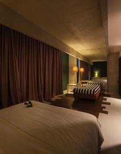 Ένα ή περισσότερα κρεβάτια σε δωμάτιο στο Hotel Locanda del Benaco