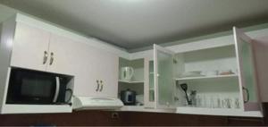 TV a/nebo společenská místnost v ubytování ONE OASIS a1 SM MALL DAVAO FREE POOL WIFI