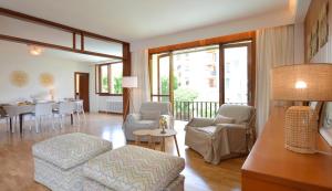 a living room with a couch and a table at Villa Palma in Palma de Mallorca