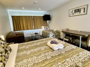 Postel nebo postele na pokoji v ubytování Airport Delta Motel