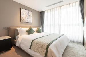 Ліжко або ліжка в номері Cresasia Residence