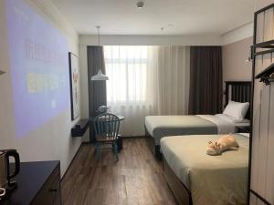 Fotografie z fotogalerie ubytování 银座精宿菏泽中华路银座商城火车站店 v destinaci Heze