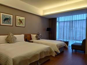Postel nebo postele na pokoji v ubytování Walden Hotel