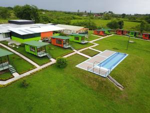 an aerial view of a house with a swimming pool at Glamping - Calochorno in Alcalá