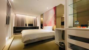 Voodi või voodid majutusasutuse Artinn藝築文旅-台北站前館 toas