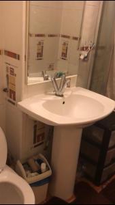 a bathroom with a sink and a toilet at Arbnb Comfy Sleep Guest House Self Catering Private Bedrooms 60 pound per night per person in London