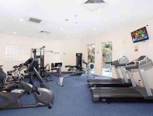 a gym with treadmills and elliptical machines at Beach apartment with all the facilities you need - Landmark Resort in Mooloolaba