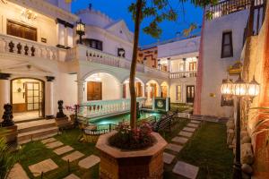 an exterior view of a building with a courtyard at Baber Mahal Vilas - The Heritage Hotel in Kathmandu