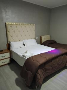Postel nebo postele na pokoji v ubytování hotel pie d'or