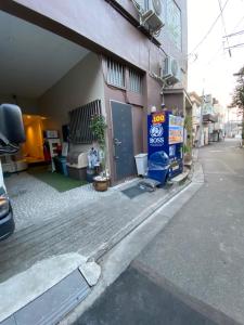 an empty street next to a building at Takemura Building 2nd floor in Tokyo