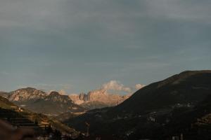 a view of a mountain range with mountains in the background at Parkhotel Mondschein, a Member of Design Hotels in Bolzano