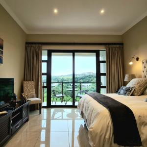 Ένα ή περισσότερα κρεβάτια σε δωμάτιο στο Luxury Golfers Paradise - Simbithi Eco-Estate - No Loadshedding
