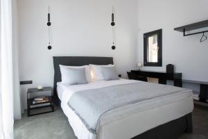 A bed or beds in a room at High-end Villa Faos Two