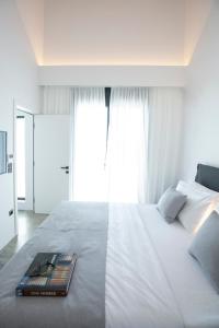 A bed or beds in a room at High-end Villa Faos Two