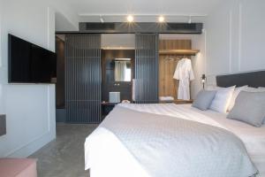 A bed or beds in a room at High-end Villa Faos Two