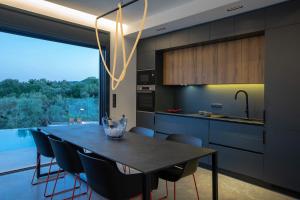 A kitchen or kitchenette at High-end Villa Faos Two