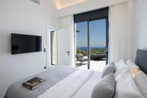 A television and/or entertainment centre at High-end Villa Faos Two
