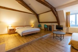 Ένα ή περισσότερα κρεβάτια σε δωμάτιο στο Le Rive Sud