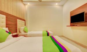 Treebo G K Residency Near Dehradun Railway Station客房内的一张或多张床位