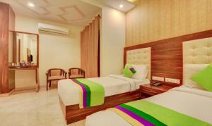 Treebo G K Residency Near Dehradun Railway Station客房内的一张或多张床位