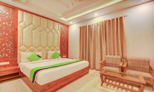Treebo G K Residency Near Dehradun Railway Station客房内的一张或多张床位