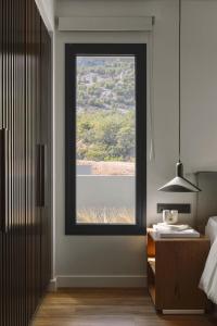 A bed or beds in a room at Aposperia Memorable Living