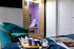 a room with a table and a chair and a mirror at Vespri Luxury Rooms & Suites in Palermo