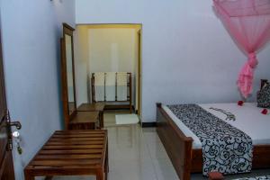 Postel nebo postele na pokoji v ubytování Nimsara Lodge Sigiriya