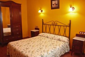 Łóżko lub łóżka w pokoju w obiekcie Apartamentos Trinidad