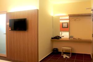 TV a/nebo společenská místnost v ubytování Fomecs Boutique Hotel, Jonker Street