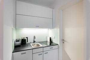 A cozinha ou cozinha compacta de Studiohouse Frankfurt