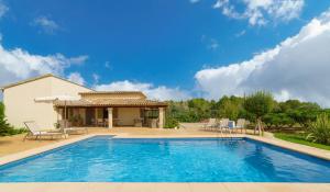 una piscina frente a una casa en Villa Marina Malagarba By SunVillas Mallorca, en Pollensa