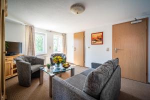 Posezení v ubytování Murphy's Zimmer und Apartments