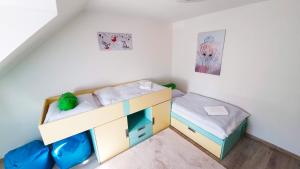 Postel nebo postele na pokoji v ubytování PATTY Garni