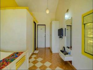 TV a/nebo společenská místnost v ubytování Kokanwadi Resort