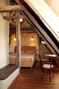 เตียงในห้องที่ Maison de 4 chambres avec piscine partagee et jardin amenage a Saint Cybranet