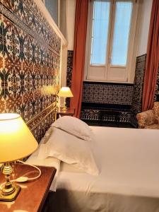Posteľ alebo postele v izbe v ubytovaní Hotel Simon