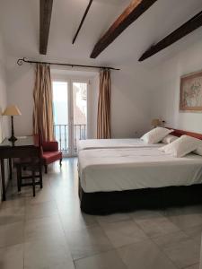Posteľ alebo postele v izbe v ubytovaní Hotel Simon