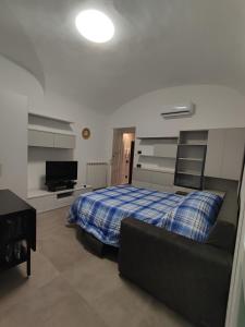 Posteľ alebo postele v izbe v ubytovaní CASA VACANZE - ANTICO CONVENTO