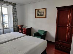 Posteľ alebo postele v izbe v ubytovaní Hotel Simon