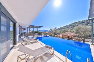 a villa with a swimming pool with a view at Villa Kas Bohem in Kaş