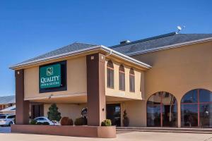 a building with a sign on the front of it at Quality Inn & Suites Owasso US-169 in Owasso