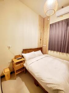 Giường trong phòng chung tại 挈客茵民宿