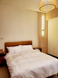מיטה או מיטות בחדר ב-挈客茵民宿