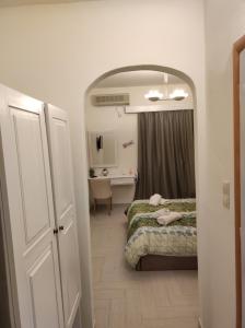A bed or beds in a room at Panorama Hotel - Restaurant