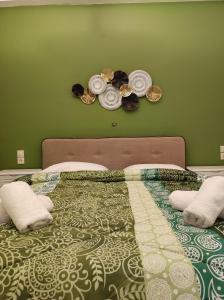A bed or beds in a room at Panorama Hotel - Restaurant